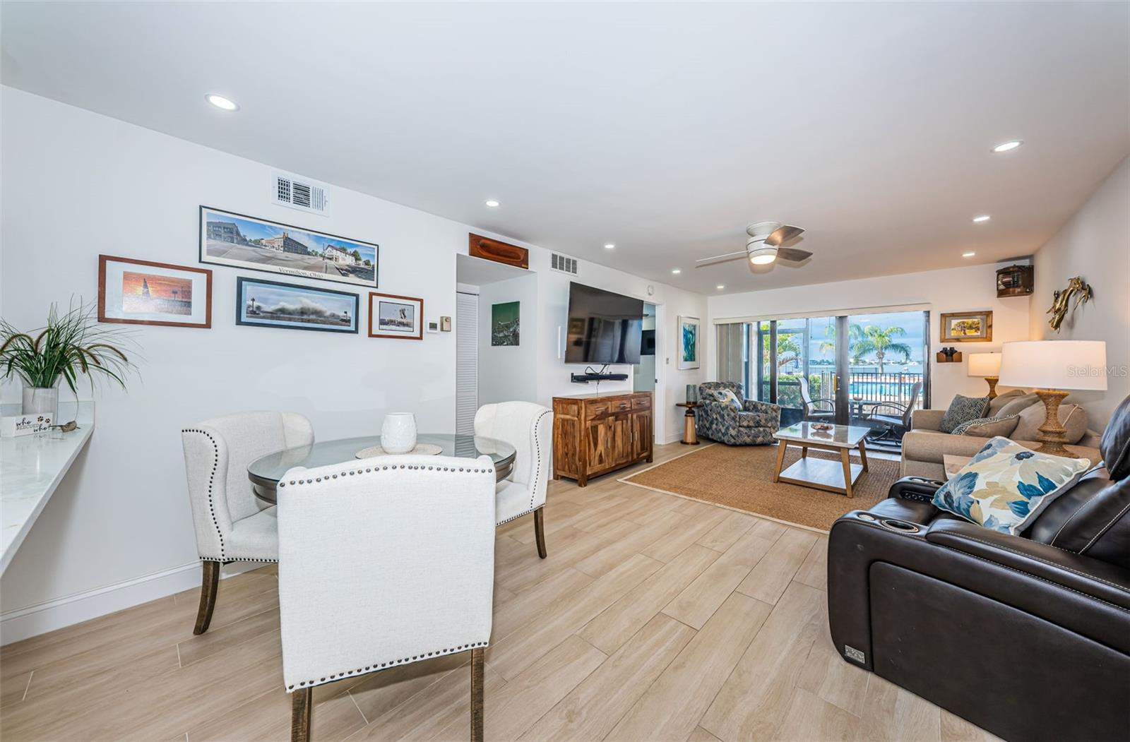 Modern wood-look ceramic tile throughout the condo offers style with ease of care