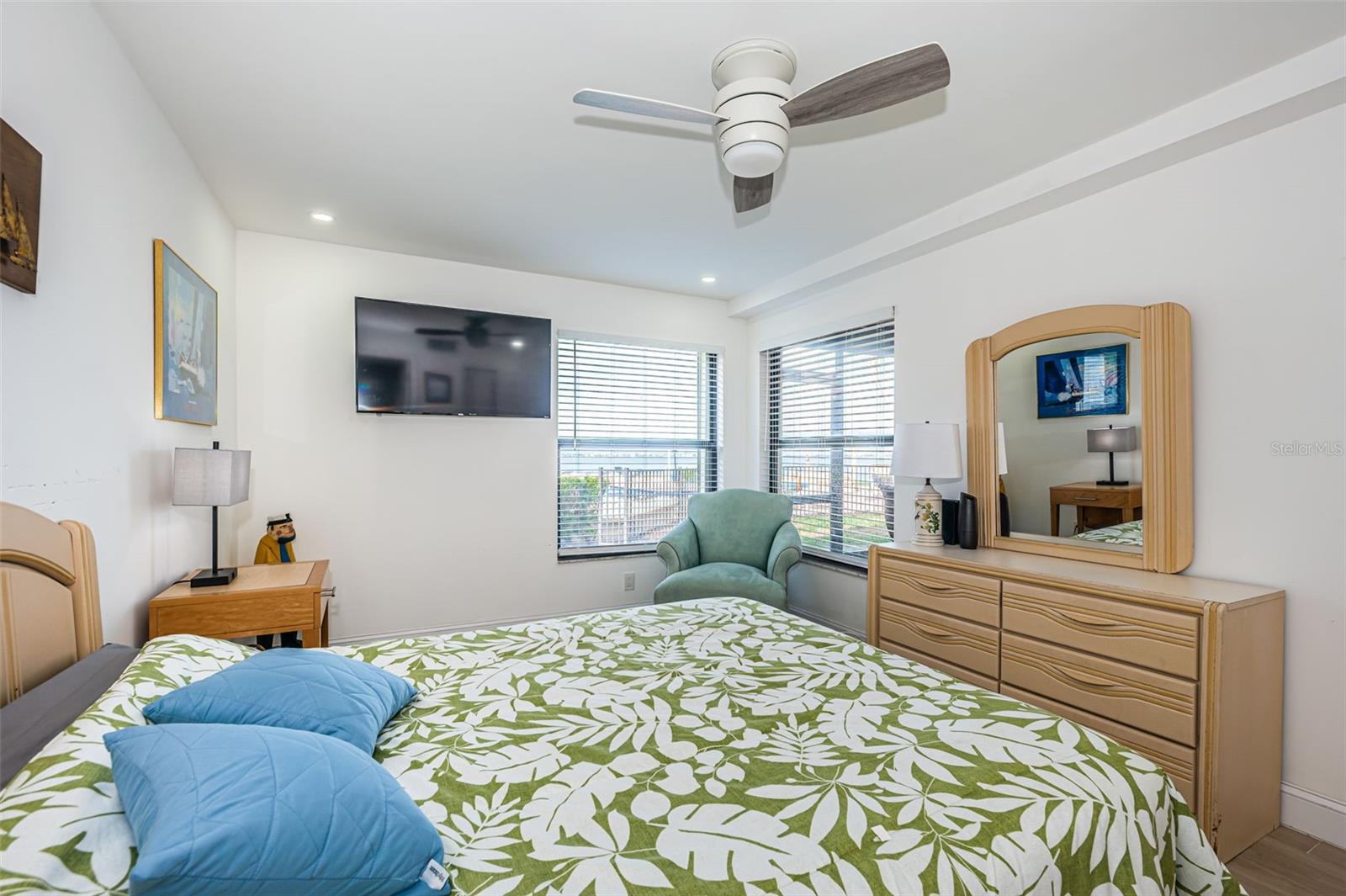 Master bedroom has sliding doors leading to screened patio