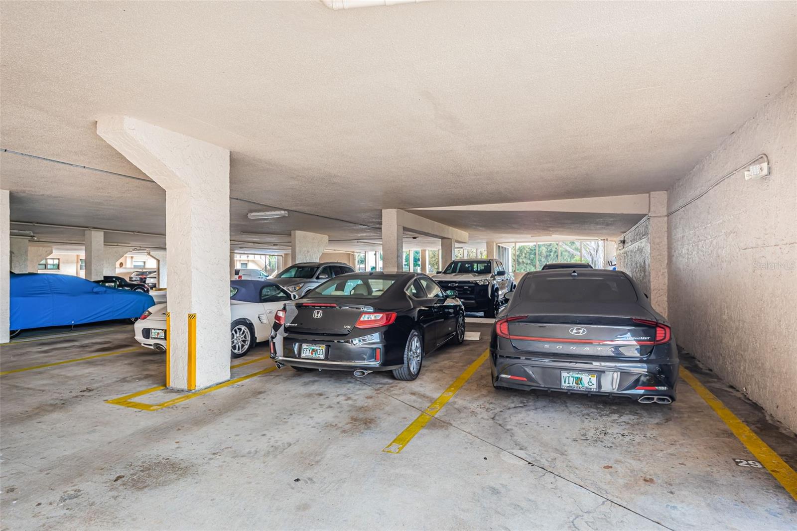 Covered parking space #29 convenient to villa #103