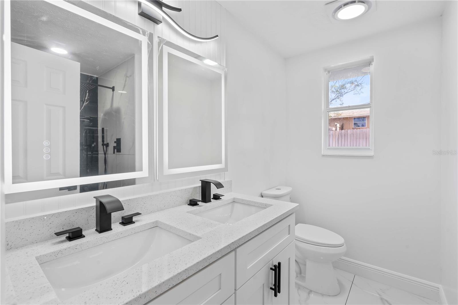 Updated bathroom with modern vanity and fixtures