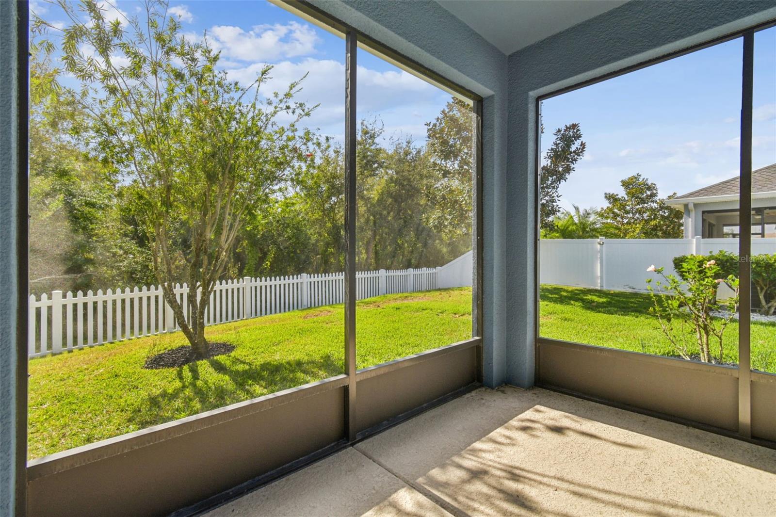 Screened, covered rear porch- perfect for relaxing and entertaining