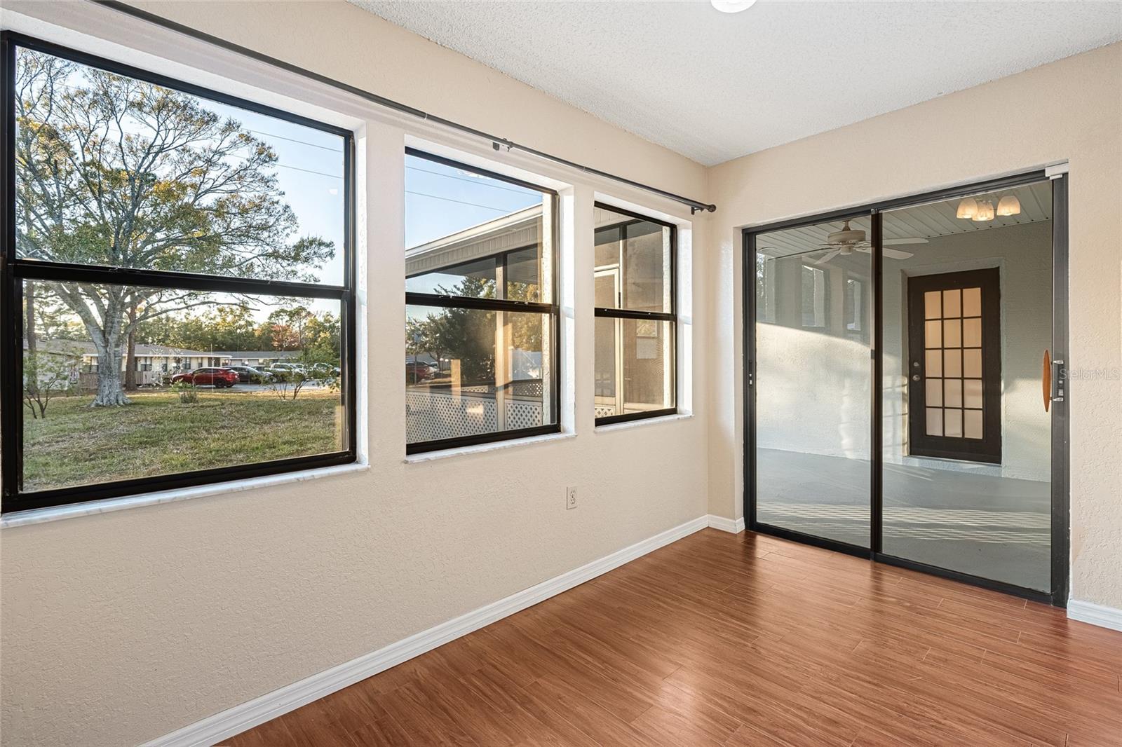 dining room area with slider going to the rear screened porch area