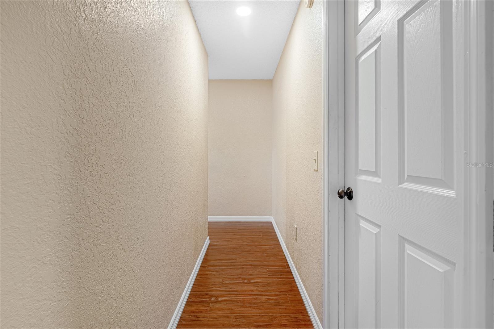 Long hallway to 2 extra bedrooms!