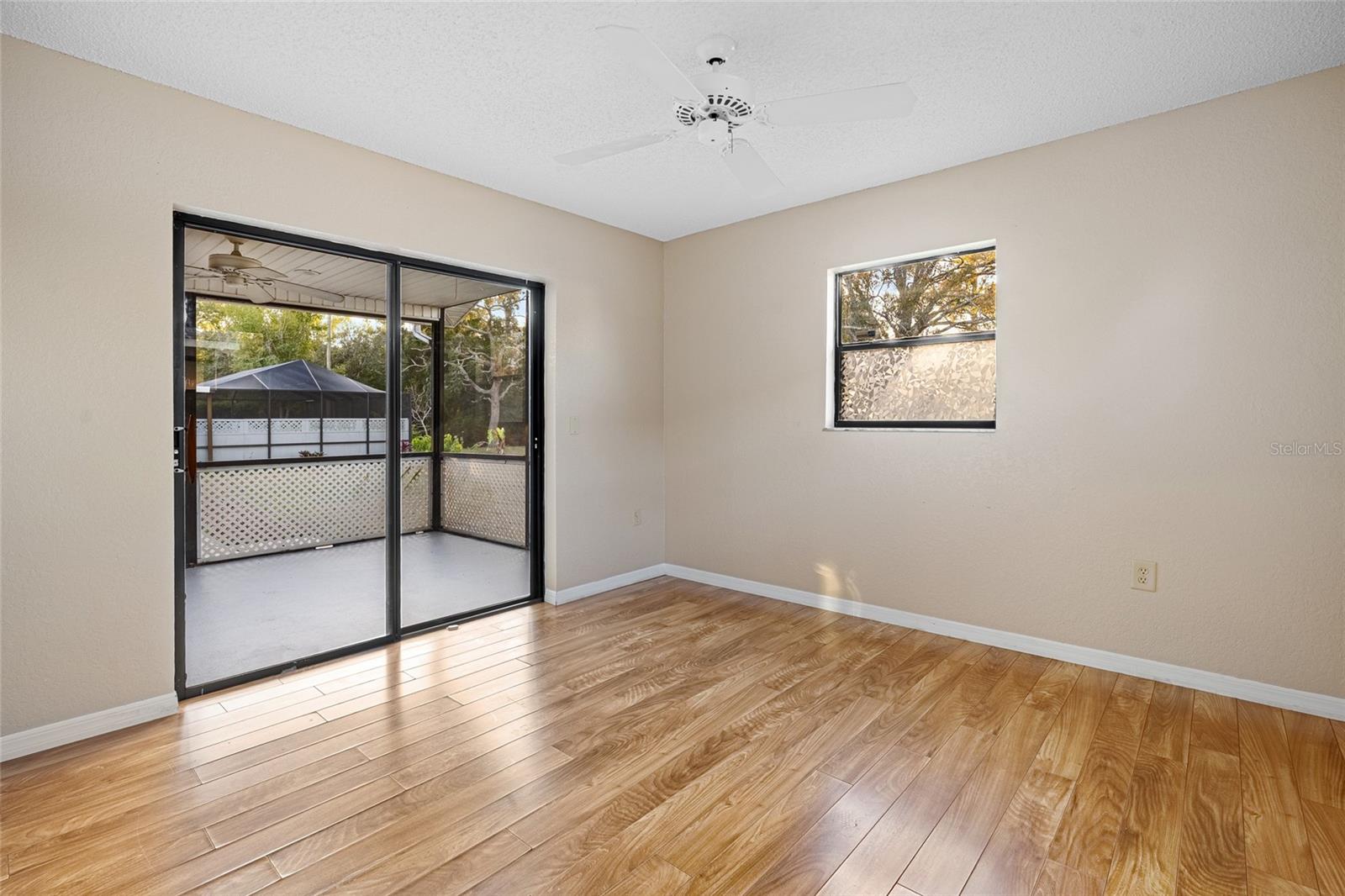 Bedroom two with sliding doors leading to the rear porch!