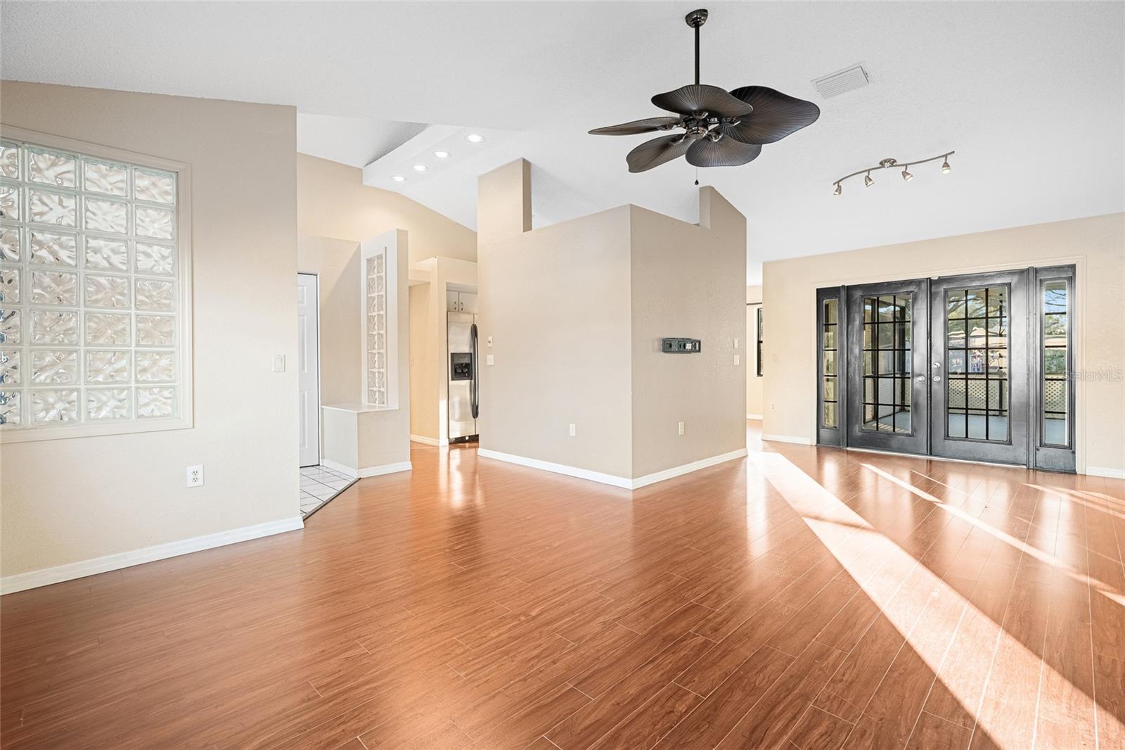 living room looking towards rear porch and kitchen behind small wall!!