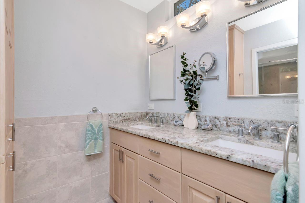 There's a beautiful custom shower and linen cabinets to the left, not shown here