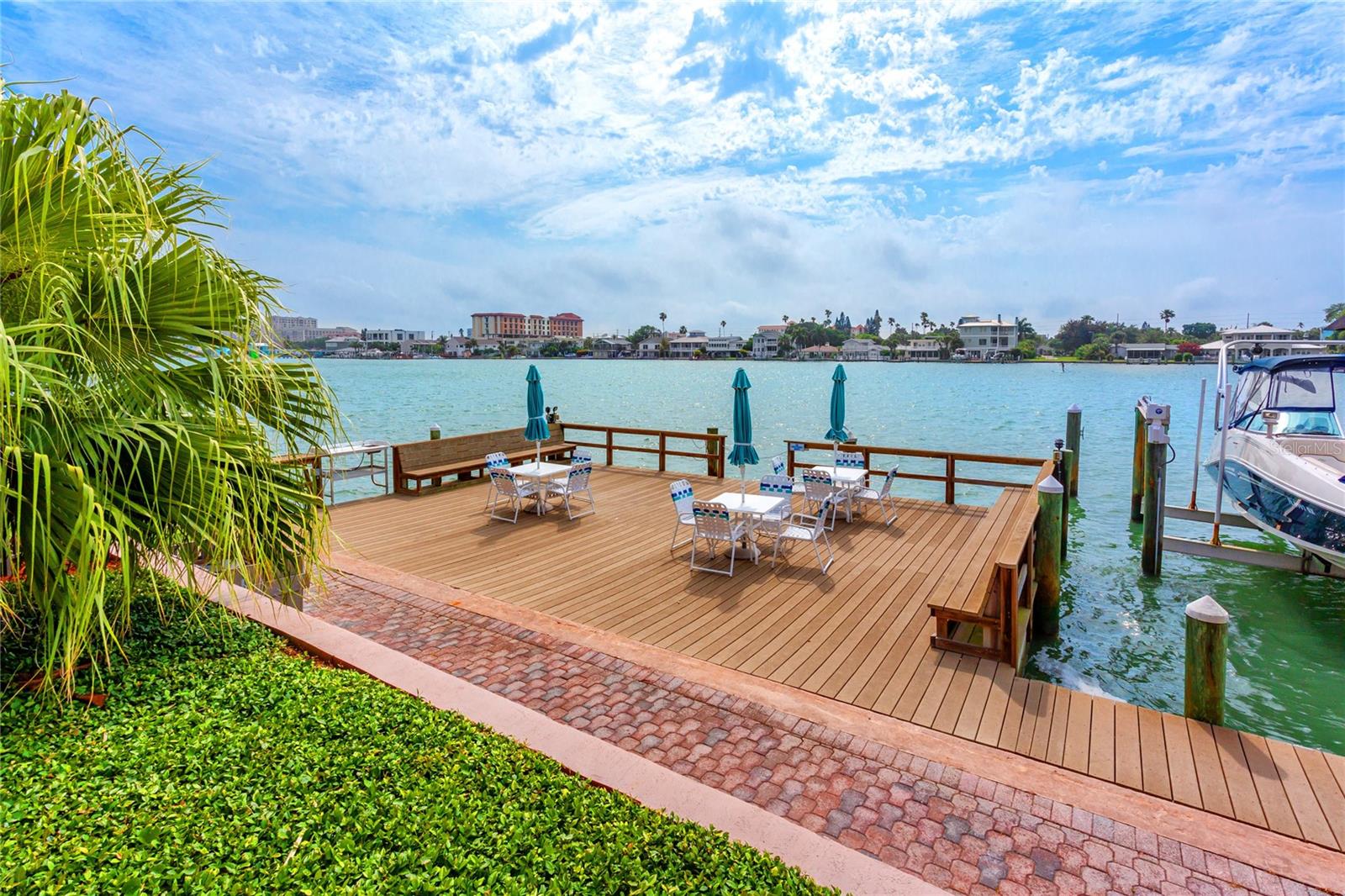 Fishing dock with cleaning station and seating to enjoy a waterfront lunch.