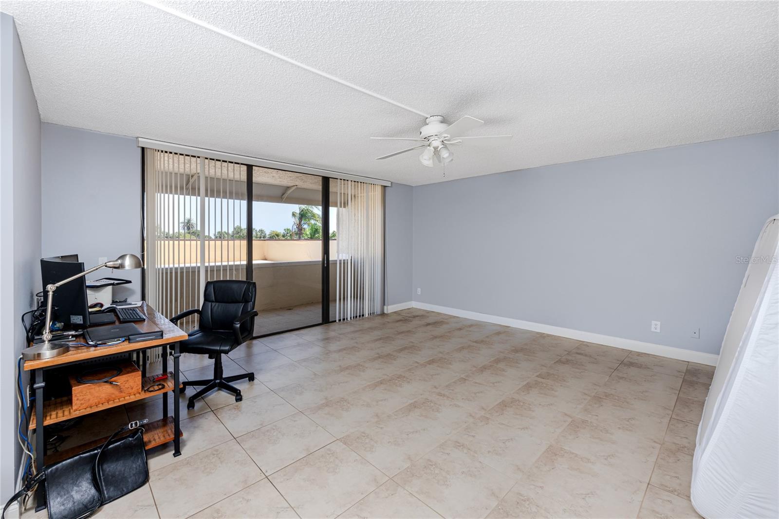 Large bedroom with private balcony.