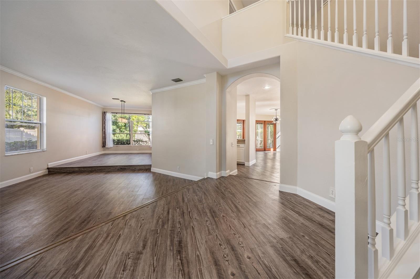 From front door. Foyer, living room, and dining in the background.