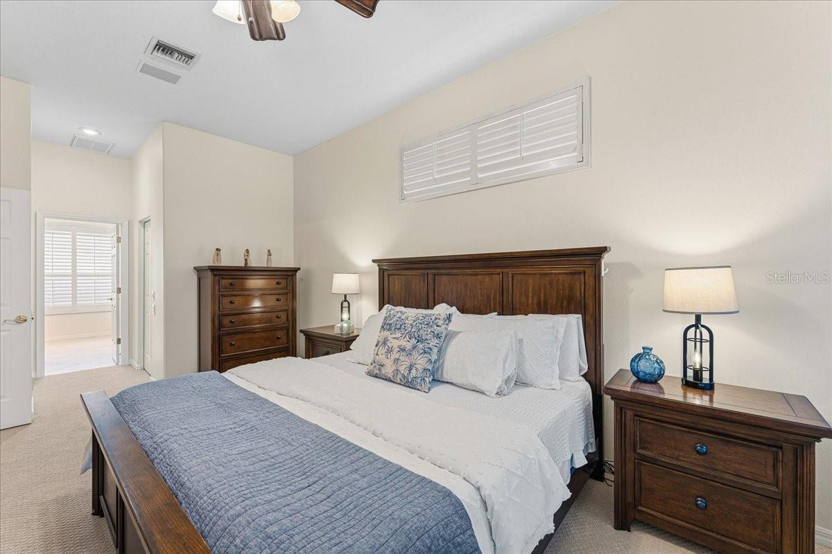 Primary Bedroom with new carpet and 2 walk-in closets