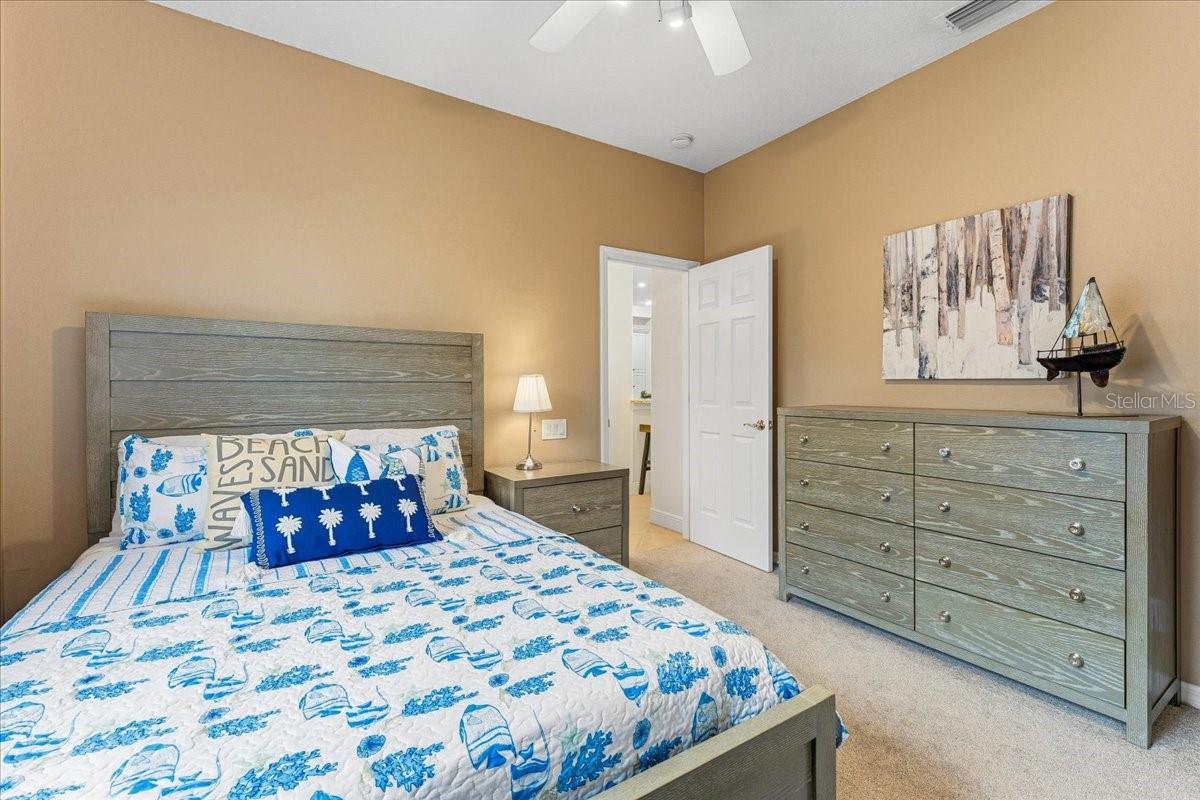 Bedroom #3 with ceiling fan and desk area