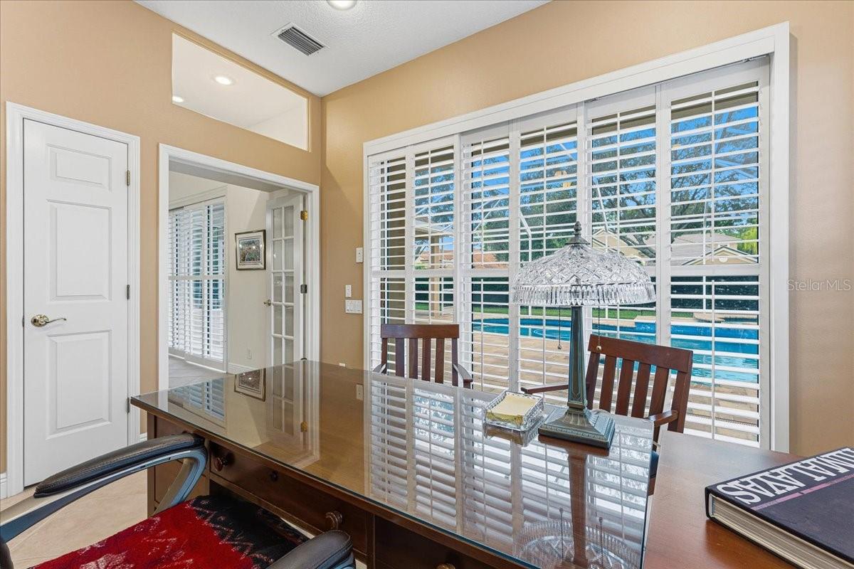 Office with shutters and French doors