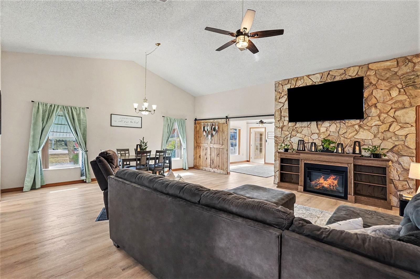 Living room overlooking the dining room and den/flex space