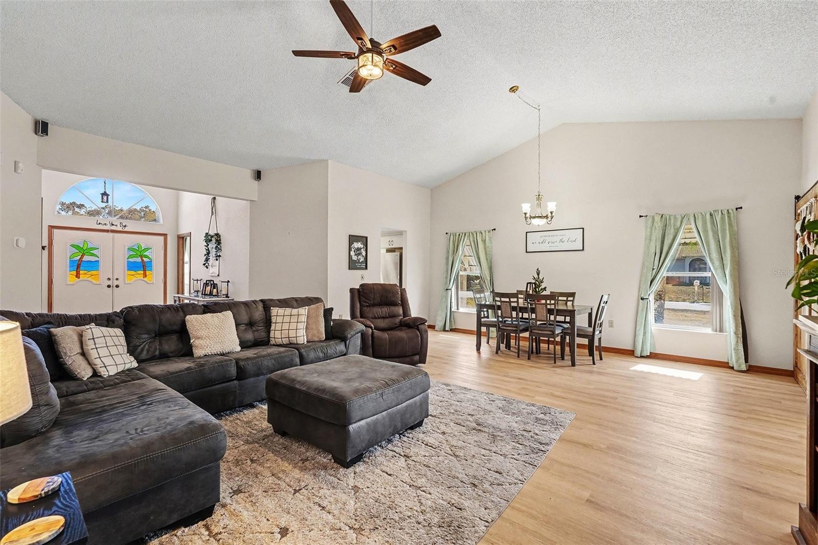 Large living room, with view of front doors and dining room