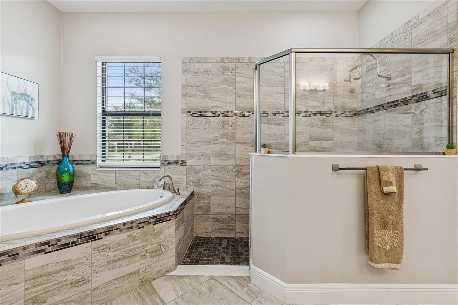 MASTER BATHROOM WITH OVERSIZED TUB AND WALK-IN SHOWER