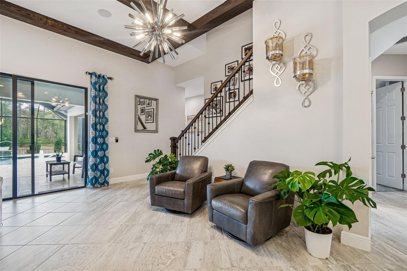 ENJOY THE BEAUTIFUL STAIRWELL ACCENT WITH SUPERB VIEWS TO THE POOL & CONSERVATION