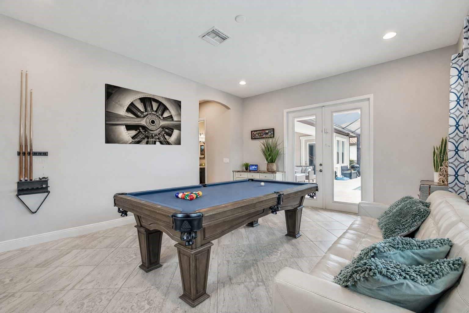 DOWNSTAIRS BONUS ROOM OFF OF POOL/LANAI