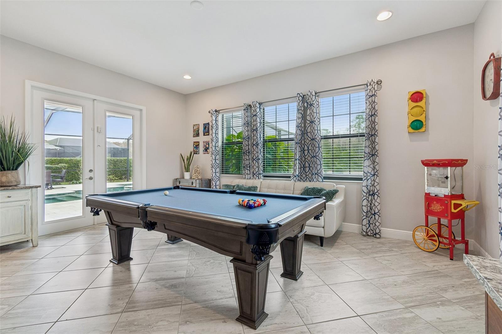 DOWNSTAIRS BONUS ROOM OFF OF POOL/LANAI