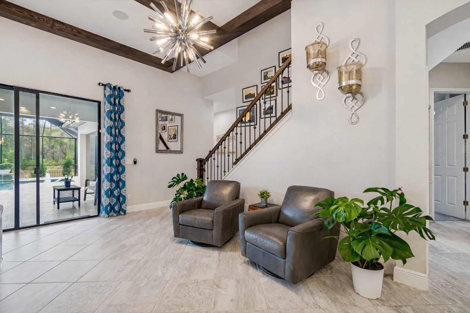 LEAVING BONUS ROOM DOWNSTAIRS TOWARD KITCHEN TO THE LEFT IS HALLWAY TO BEDROOM #2, #3, GUEST BATHROOM, & LAUNDRY