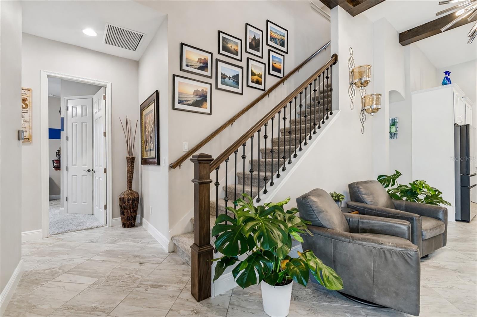 ELEGANT STAIRWELL TO BONUS ROOM UPSTAIRS