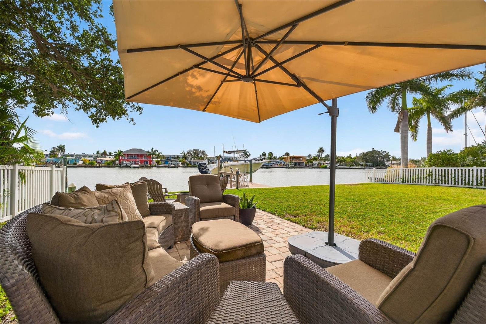 Vacation every day with these intracoastal water views and beautiful backyard