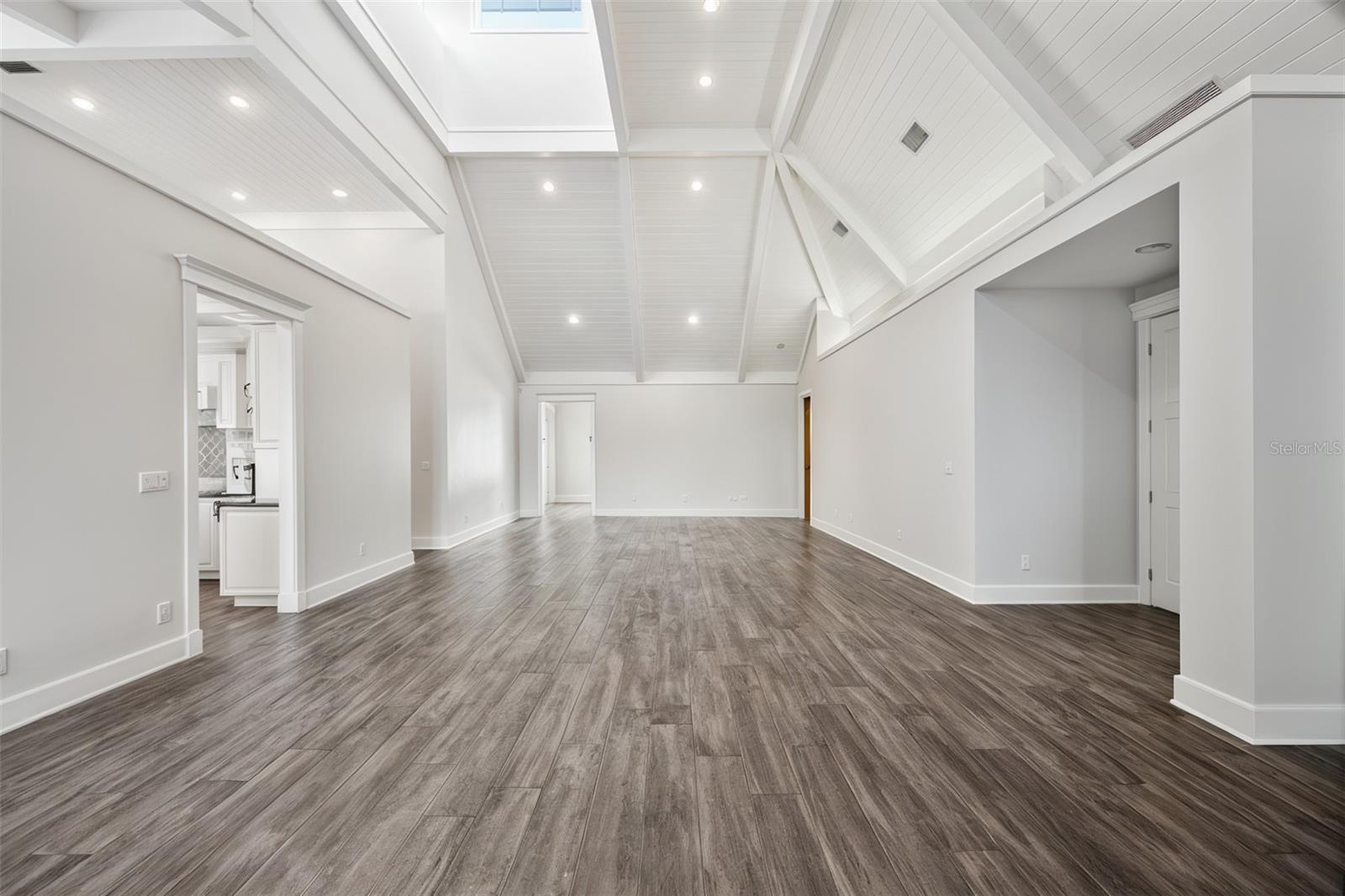 Spacious formal living and dining room featuring vaulted ceilings and a space to showcase3 the 500-gallon aquarium.
