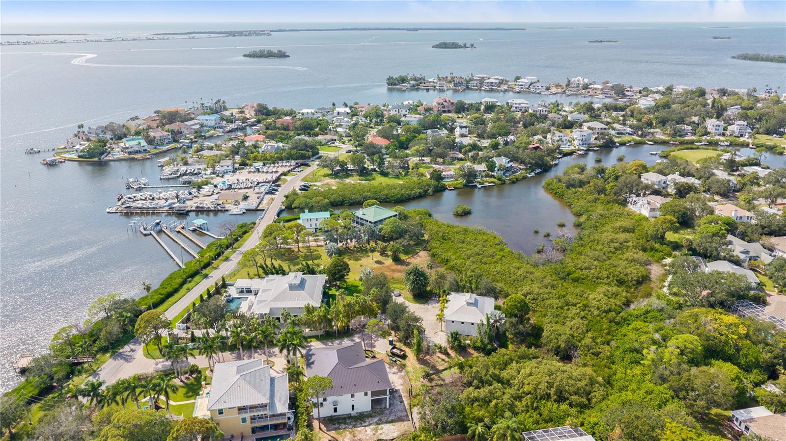 Amazing aerial view showing the property's ideal waterfront location, just moments from marinas and open Gulf waters.