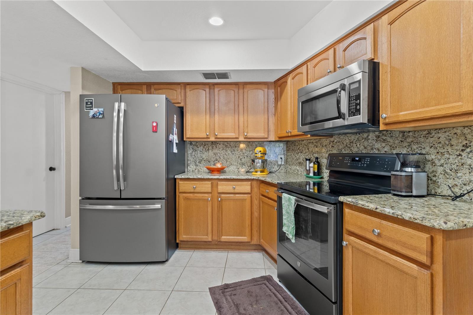 Stainless steel appliances, solid wood cabinets and granite counter tops.