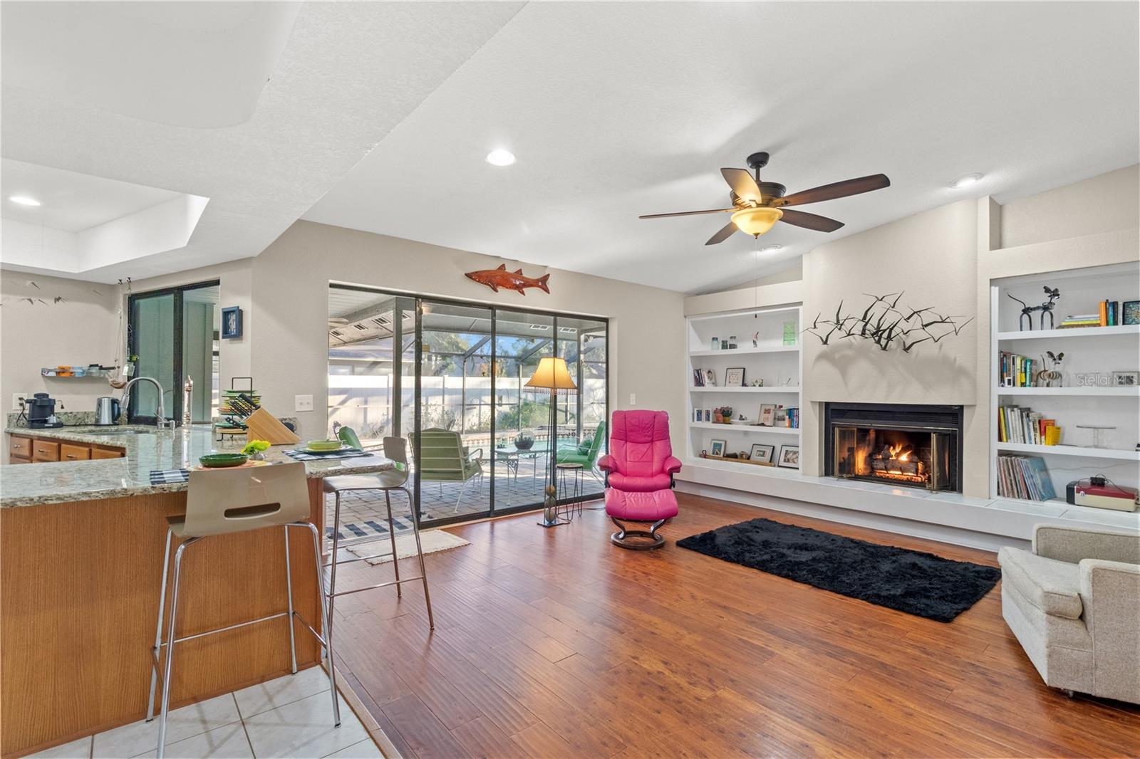 Sliders from the family room lead directly to the pool area.