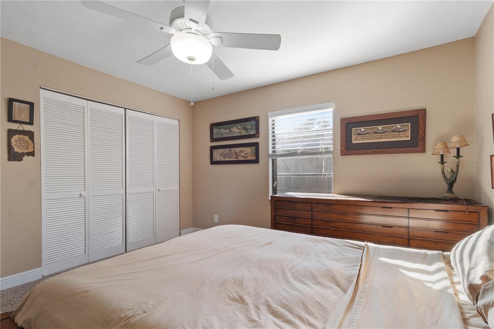 The secondary bedroom has a double reach in closet