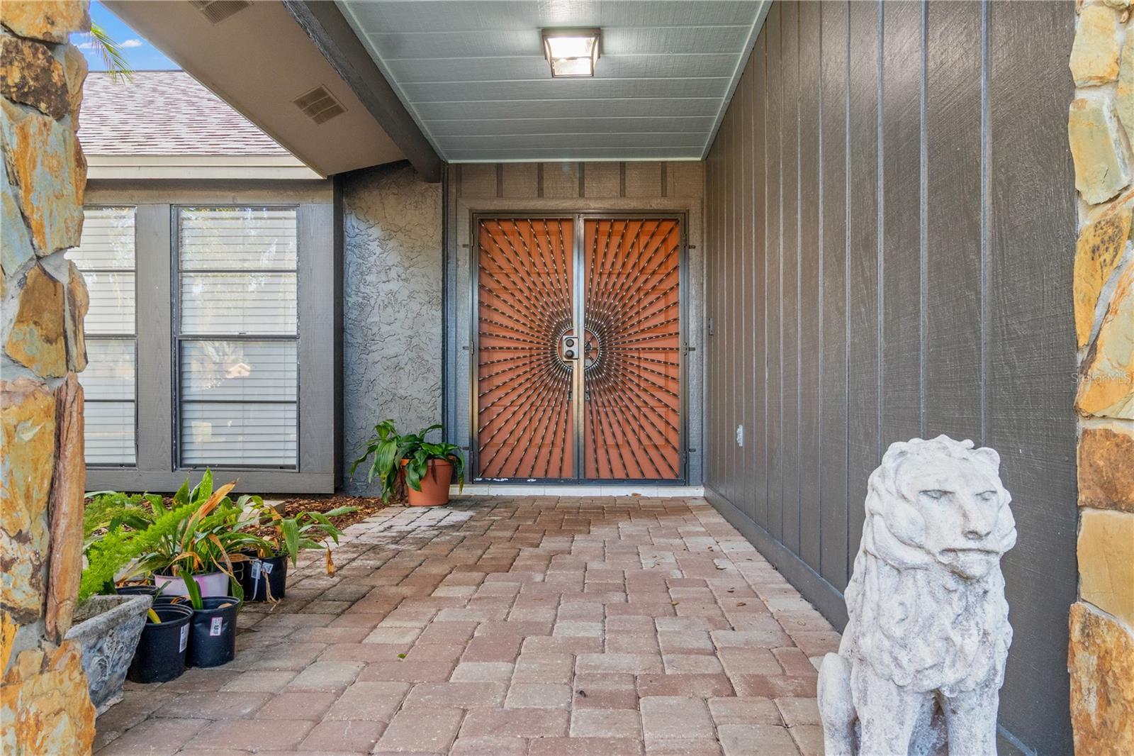 Welcome Home.  Custom designed artistic screened door.