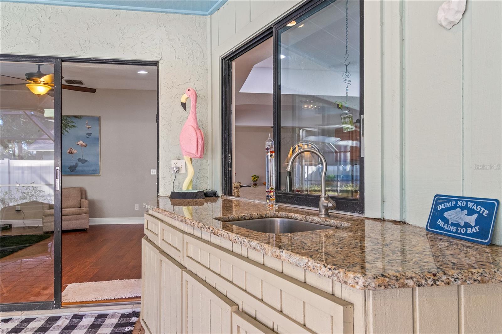 The pass through window and outdoor sink make hosting a breeze.