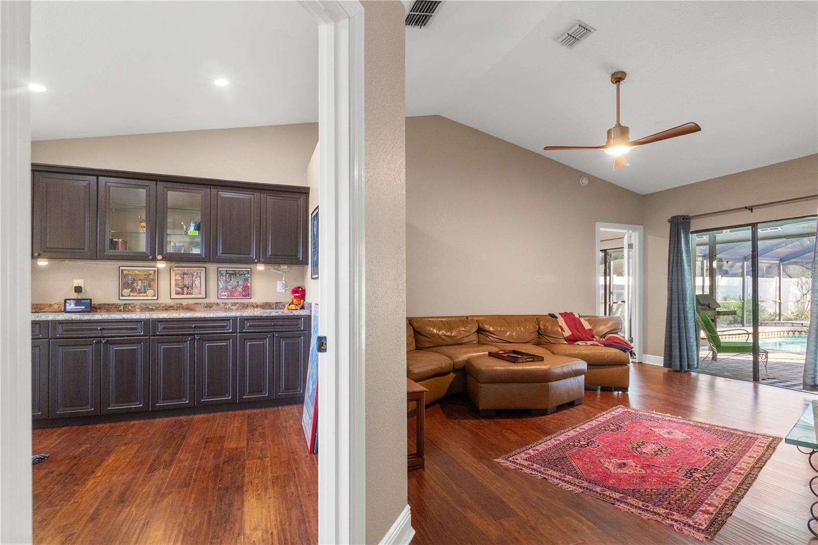 Immediately off the foyer is the separate office with an abundance of cabinetry and storage space.