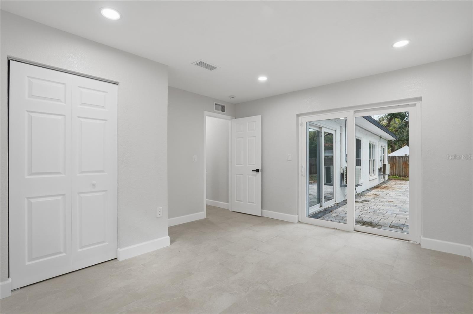 Bedroom 2 with Sliders to the Patio