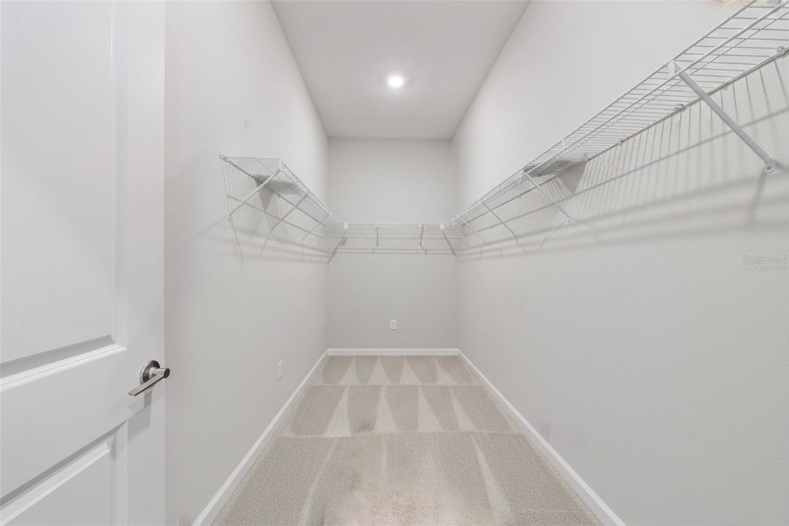 Primary closet - Virtually staged