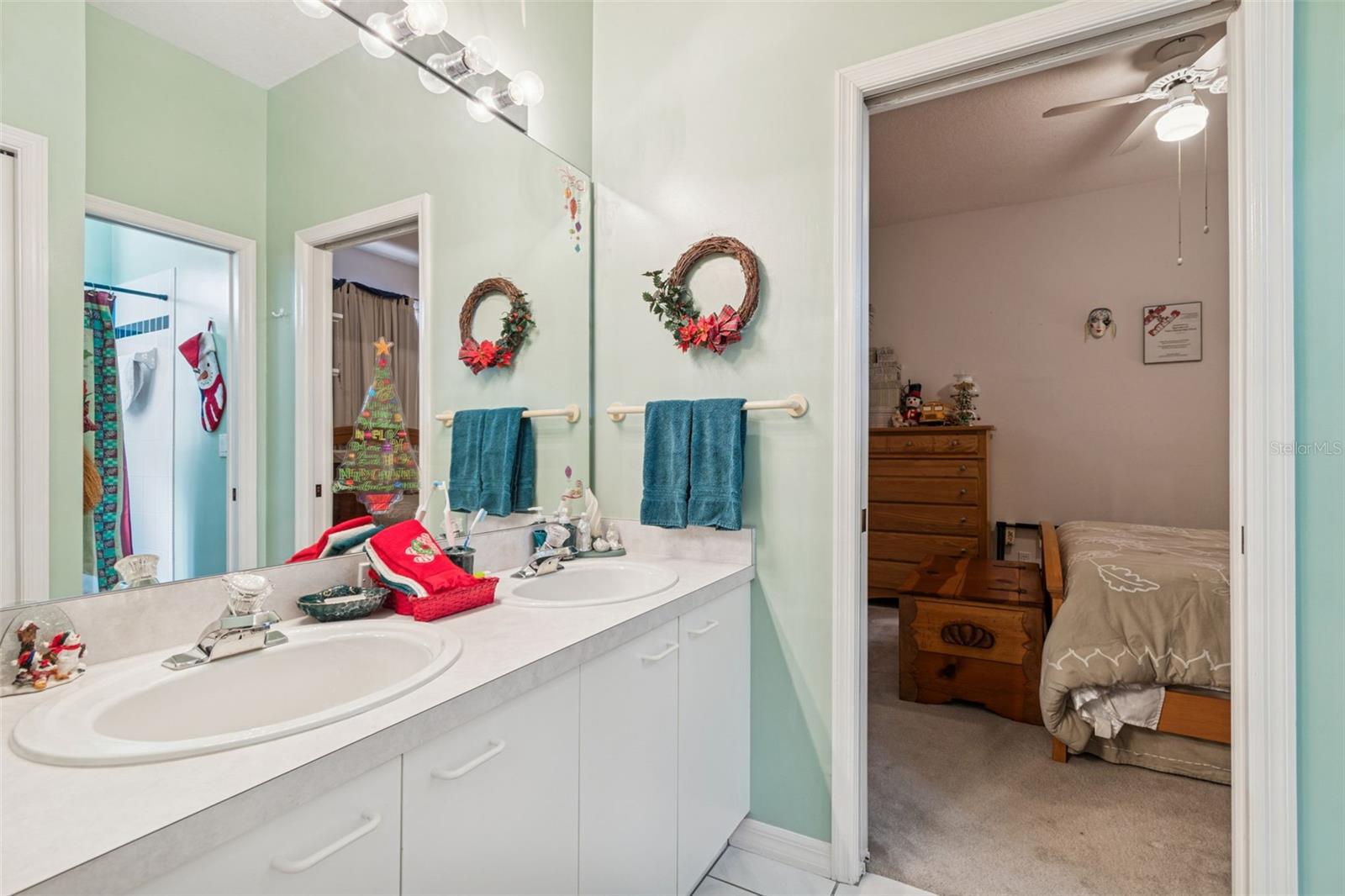 Jack & Jill Bathroom with Double Sinks and Private Toilet Room