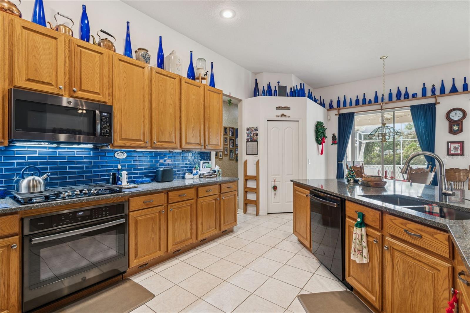 Gas Cooktop with Black Stainless Microwave, Built In Oven and Dishwasher