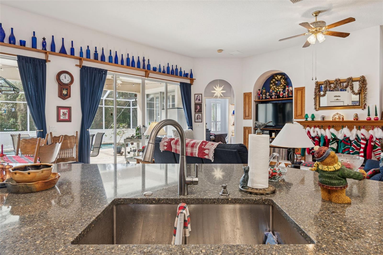 Undermount Sink in Large Kitchen Island Overlooking the Family Room