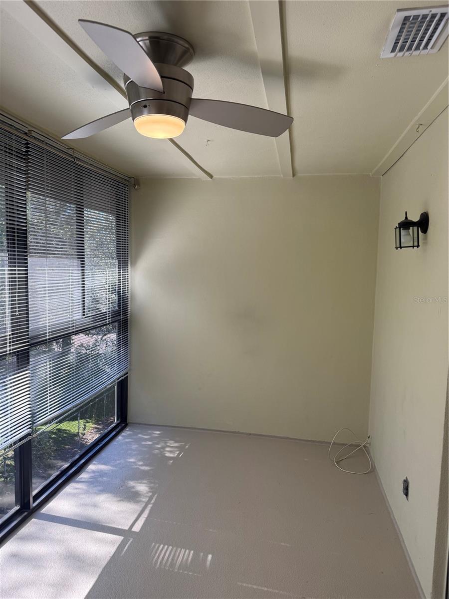 Rear enclosed patio with air