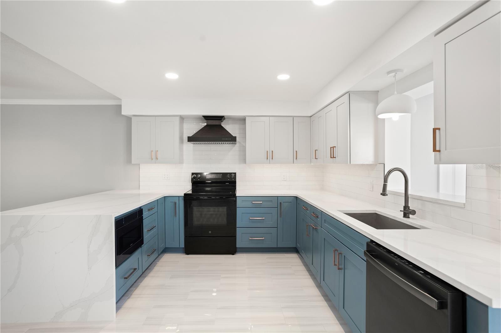 Kitchen with waterfall granite countertops