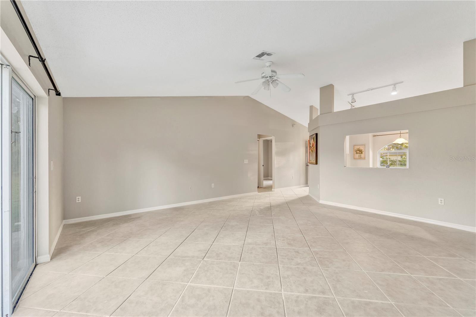Enjoy the wide open floor plan w/ high ceilings