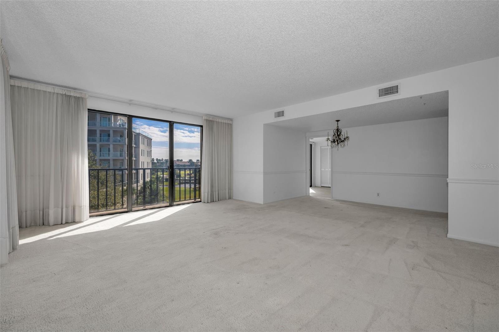 Living room is adjacent to the kitchen. (see doorway to the right and floorplan attached)