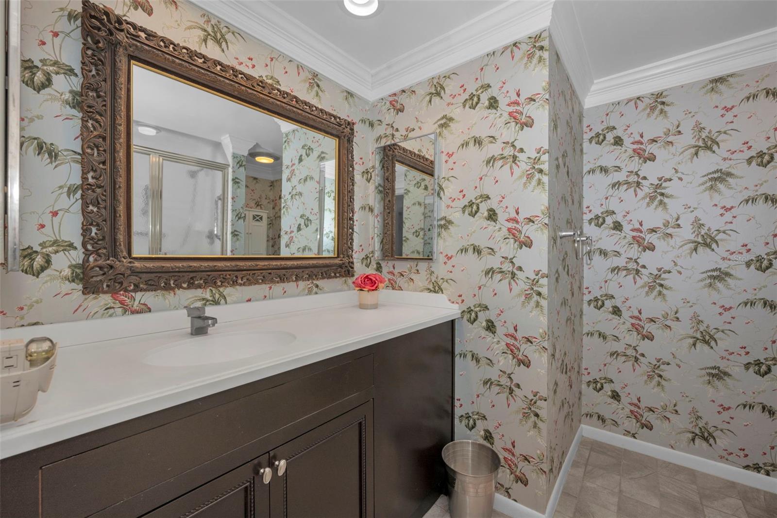 Hall bath for Guests with a walk in shower and tall toilet.