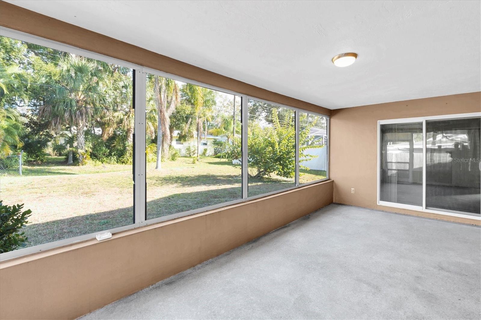 Rear enclosed screen porch