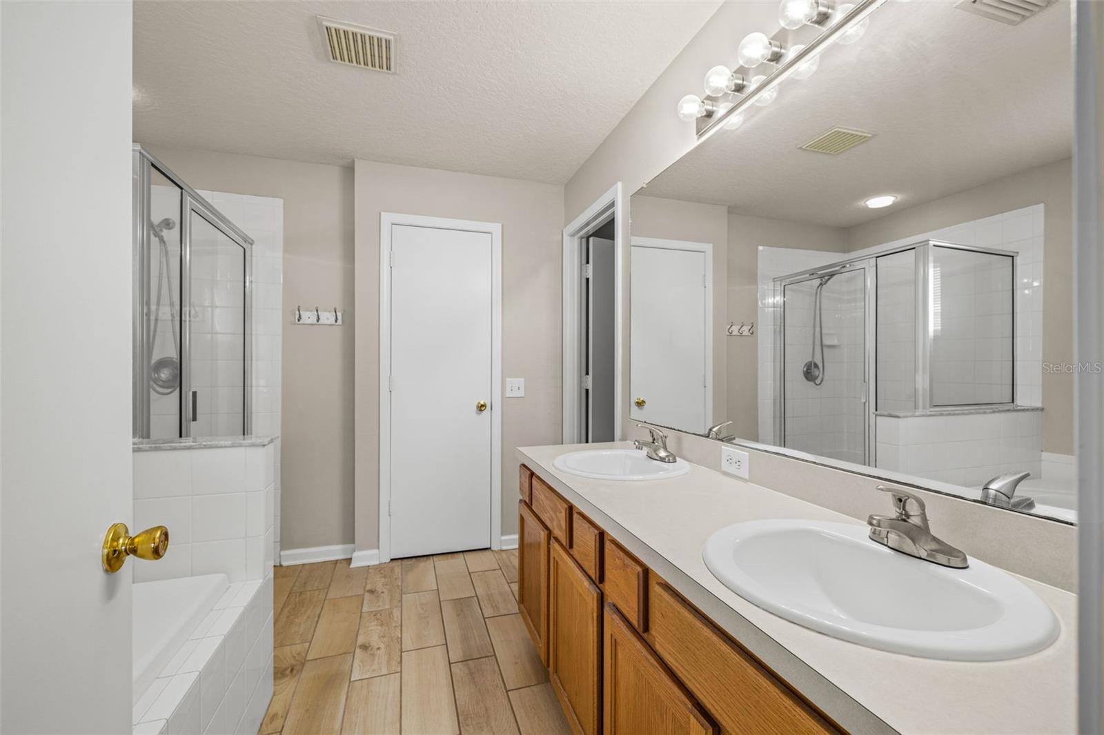 Dual vanities, soaking tub and separate walk-in shower