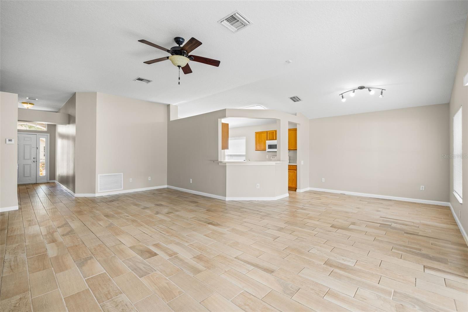 Great room leads to a dining area adjacent to the kitchen.