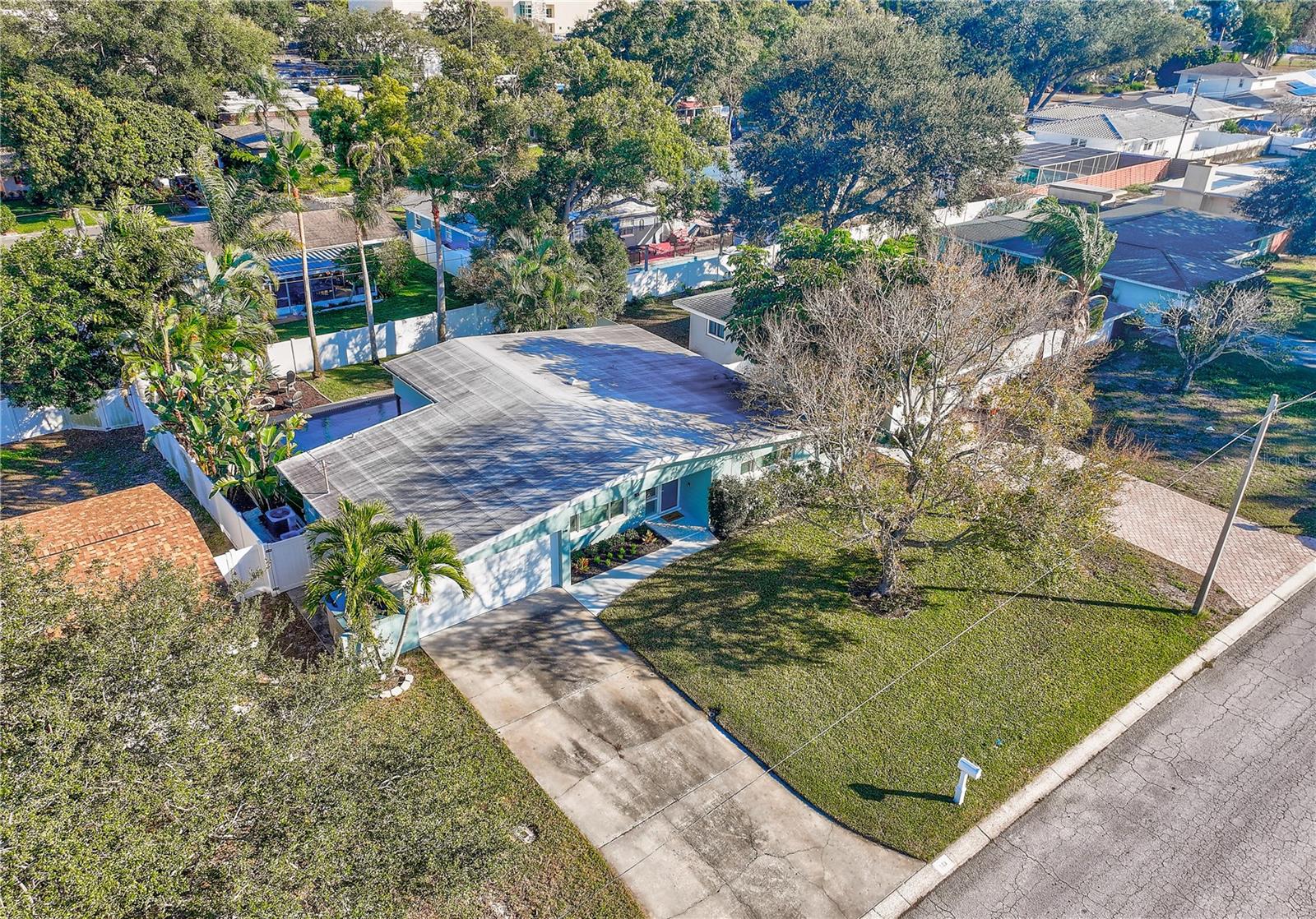 MATURE LANDSCAPING WITH TROPICAL PLANTS FOR EASY MAINTENANCE