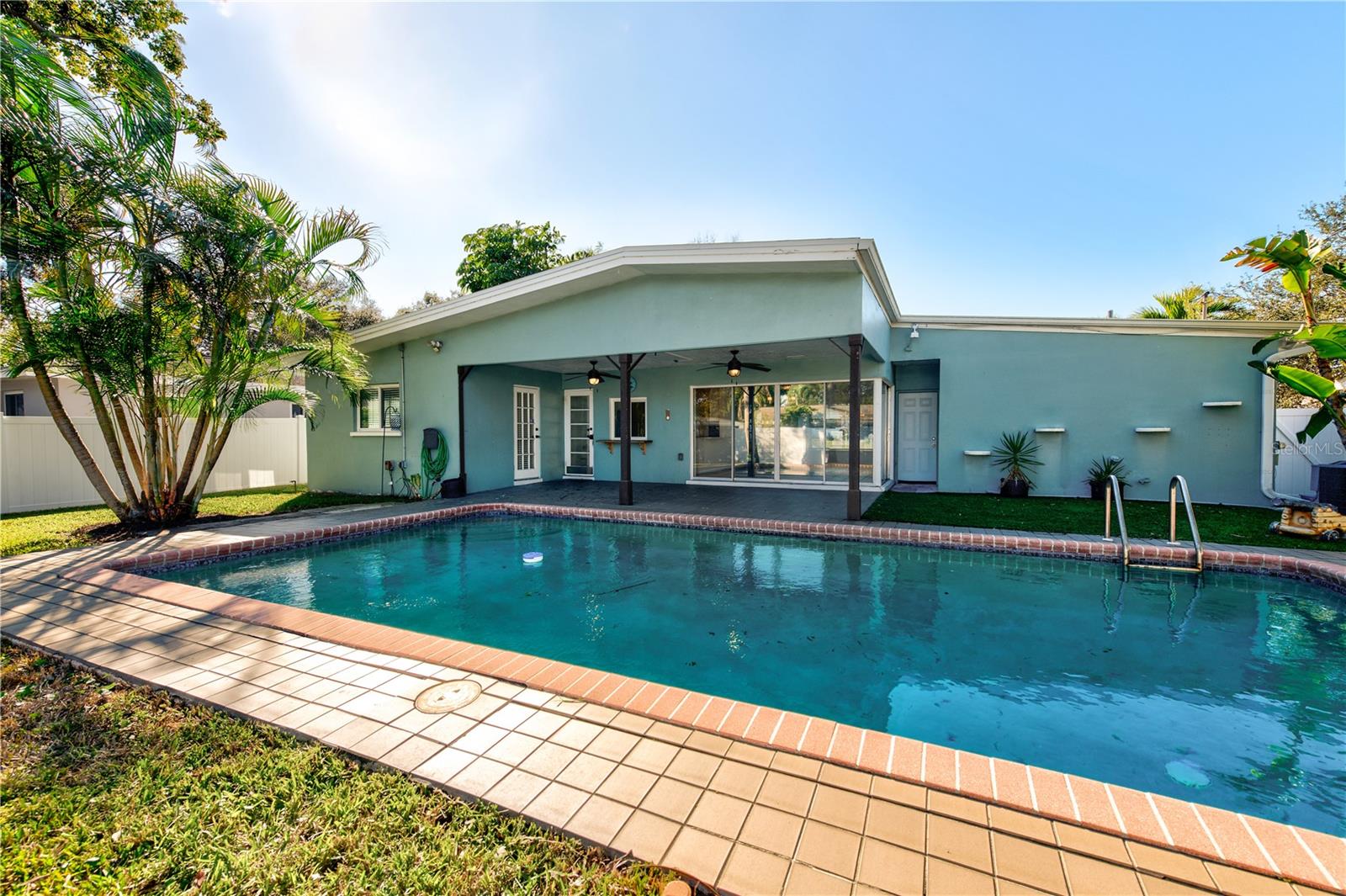 POOL OASIS WITH LOTS OF PALM TREES