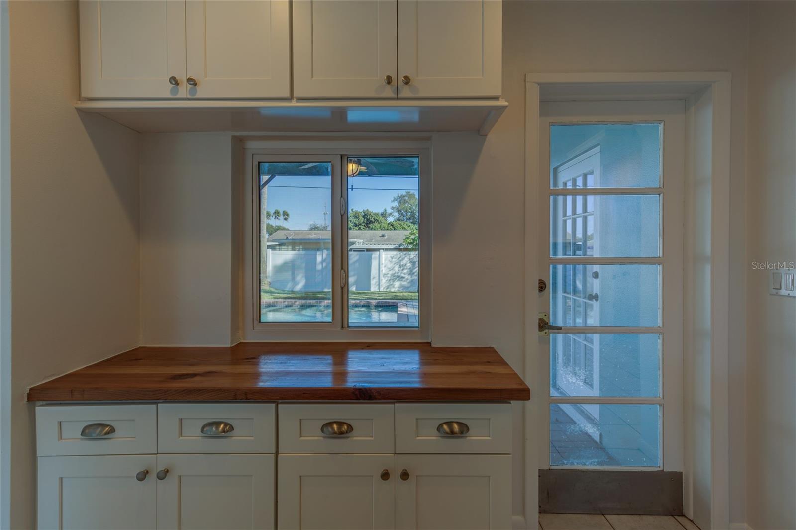 BUTCHER BLOCK COUNTER WITH PASS-THRU WINDOW TO LANAI