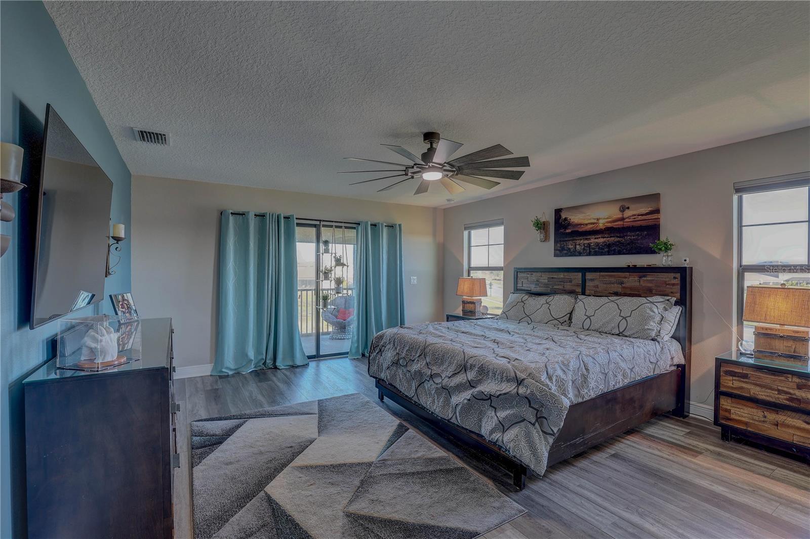 Large Master Bedroom w/access to balcony.